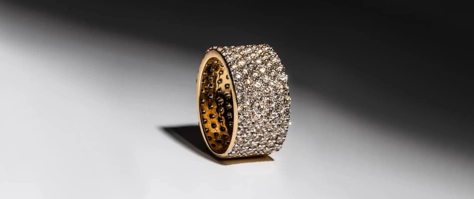 Unique Jewelry ring with sparkling crystals and gold setting, showcasing elegance and style.