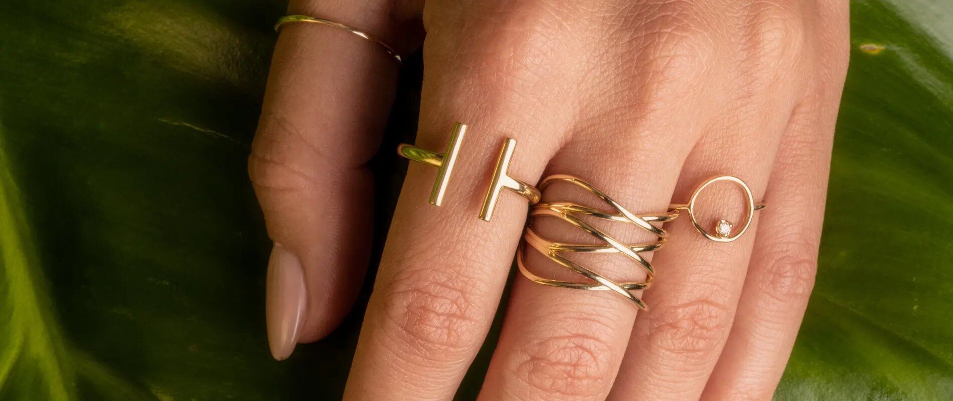Stylish gold rings on a hand, perfect gifts under 300 for jewelry lovers.