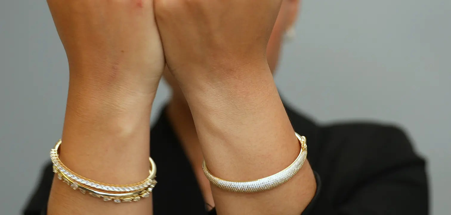 Woman’s arms showcasing bracelets