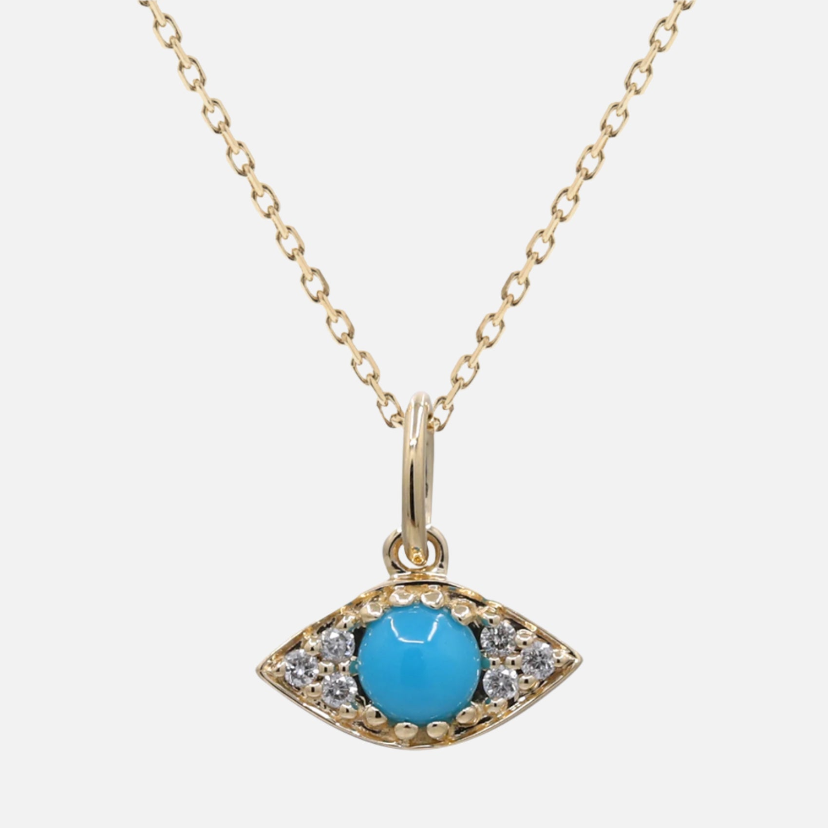 Gold necklace with a turquoise eye-shaped pendant