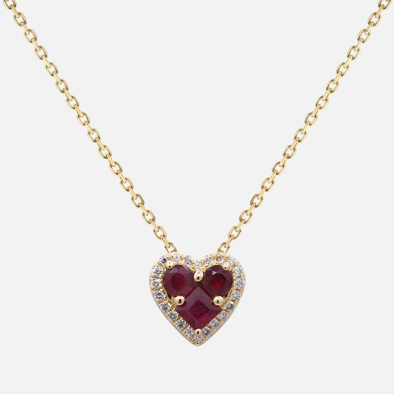 Ruby Heart Pendant with Diamond Halo in 14K yellow gold, featuring red rubies and a diamond halo, perfect for a romantic gift.