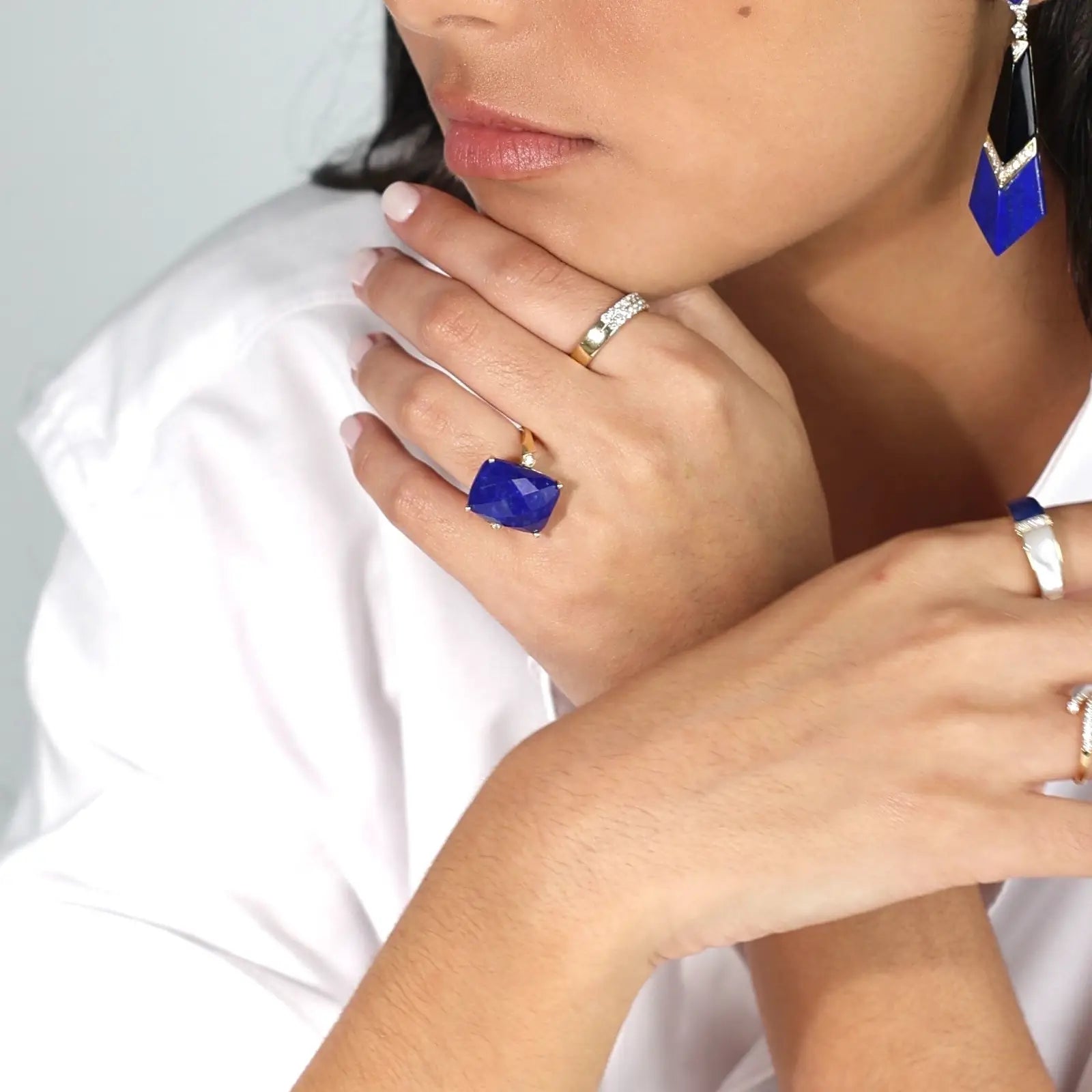 Close-up of a person wearing blue Baroque Lapis Ring