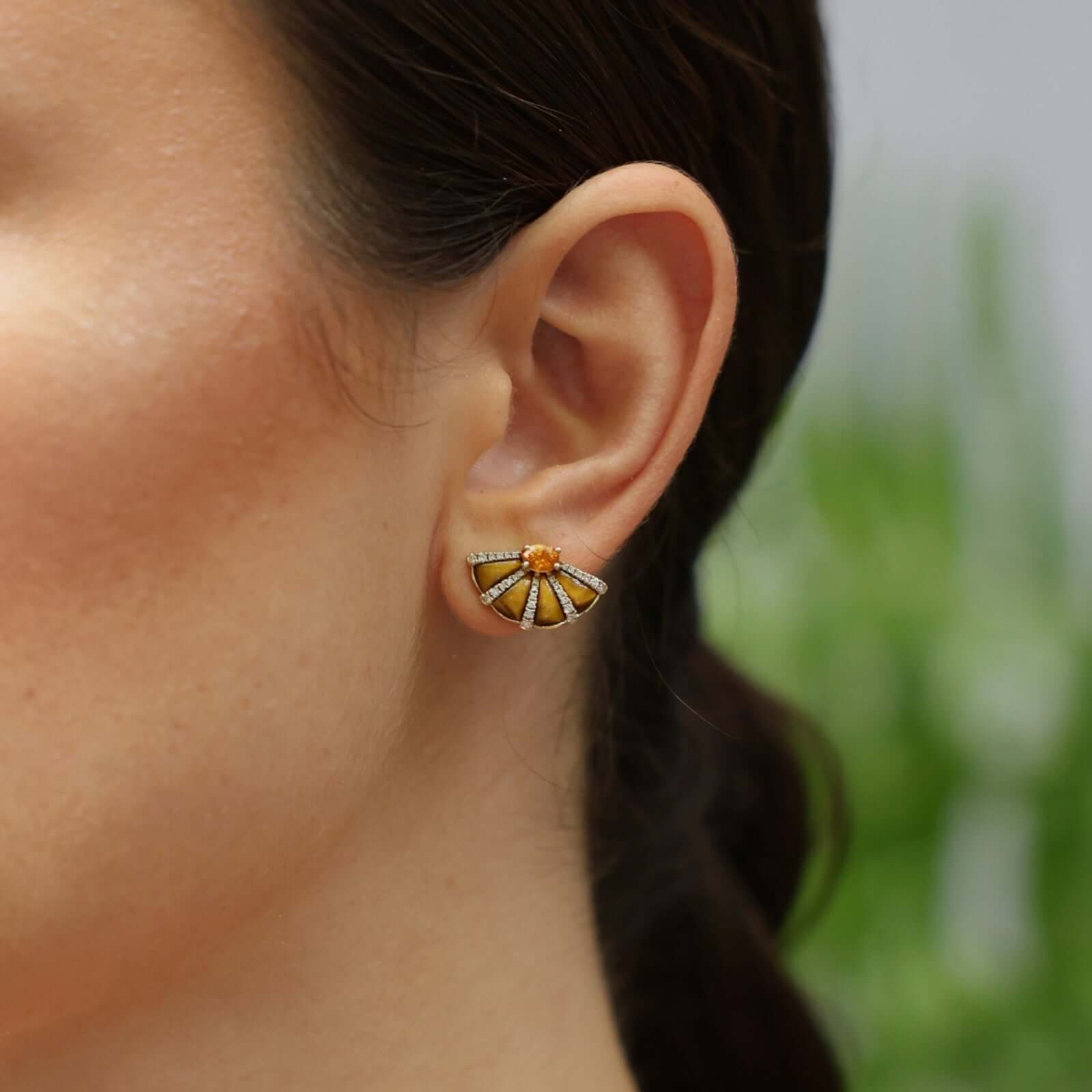 Mandarin Garnet & Tiger Eye Fan Earrings showcased in a model's ear, highlighting their elegant design and warm colors.