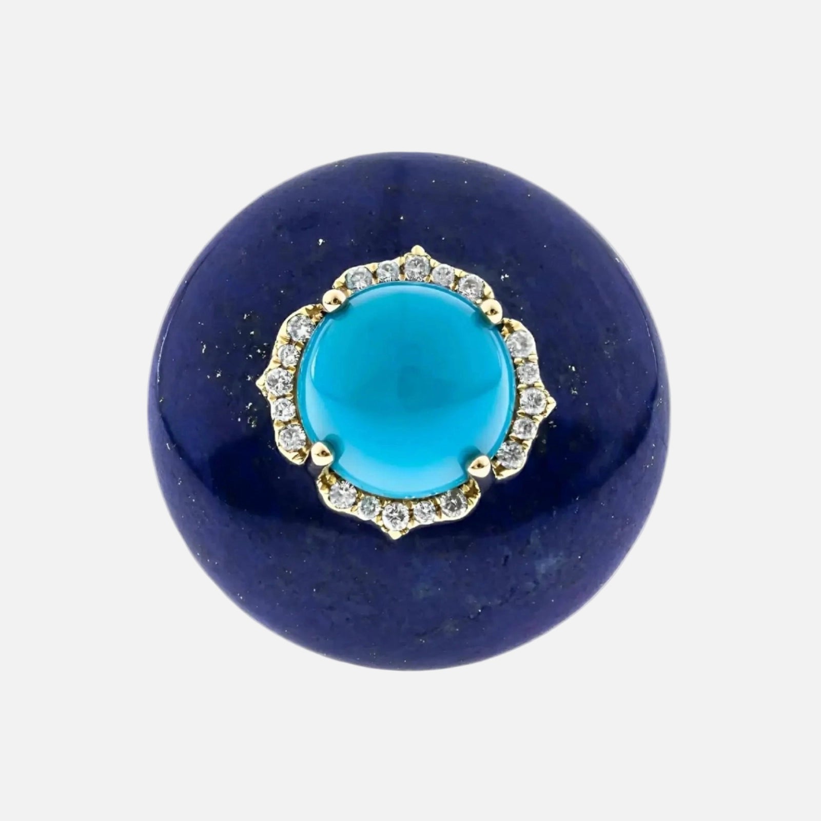 Blue stone with turquoise center and gold and silver accents on a white background