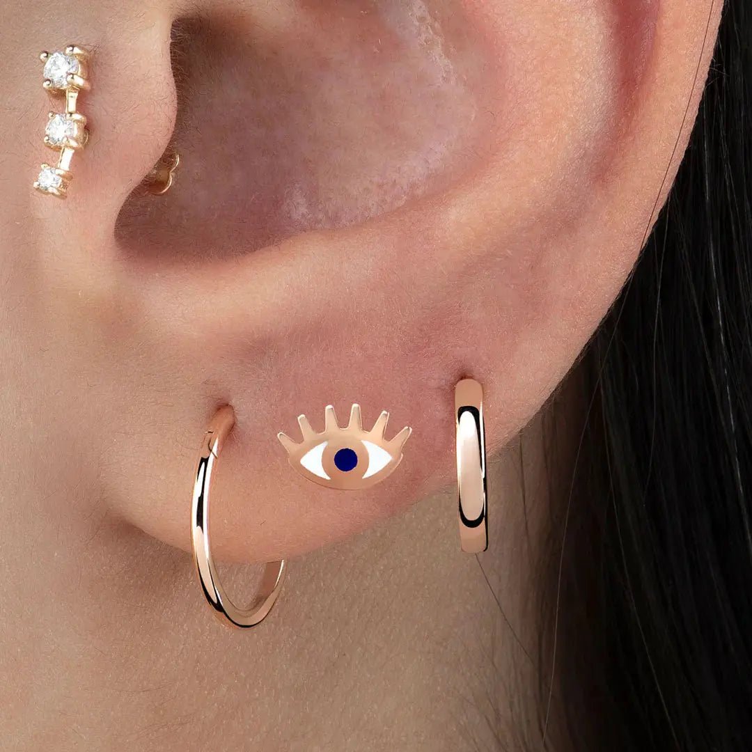Mystical Blue Eye Piercing Koru Jewelers