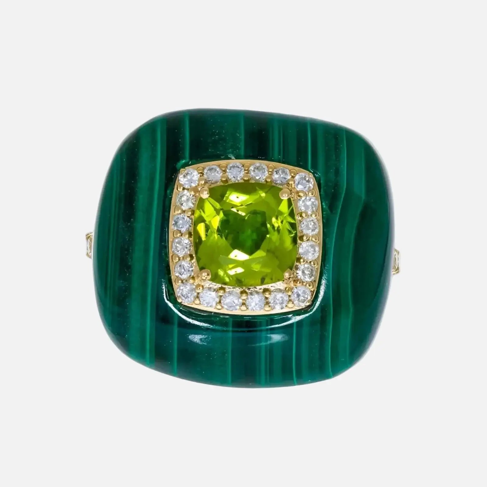 Green stone ring with gold and diamond accents on a white background