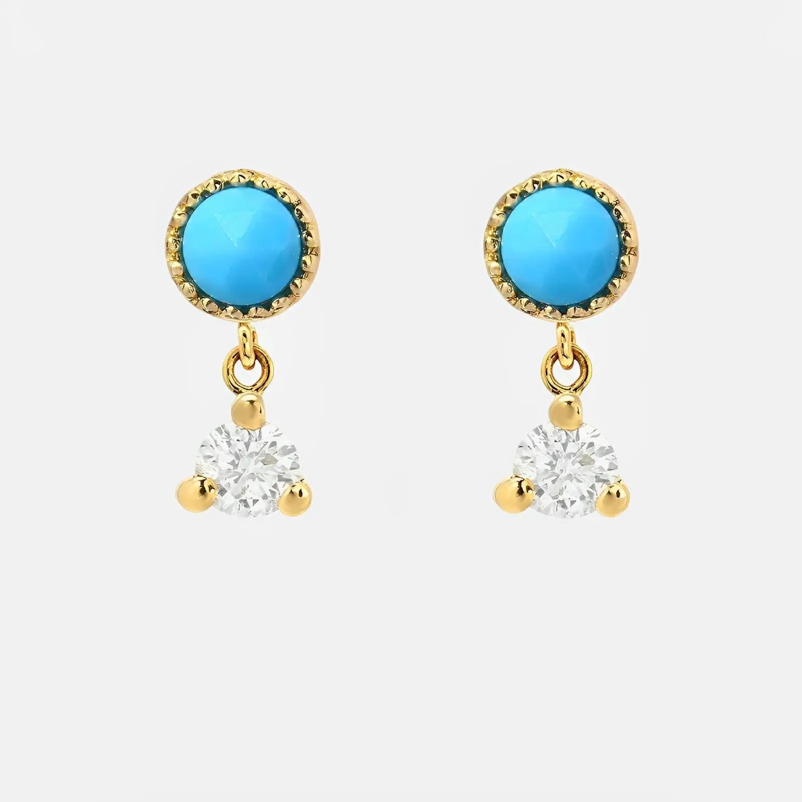 Vibrant Turquoise Stones in a Sleek Bezel Setting, Accented with Sparkling Diamonds.