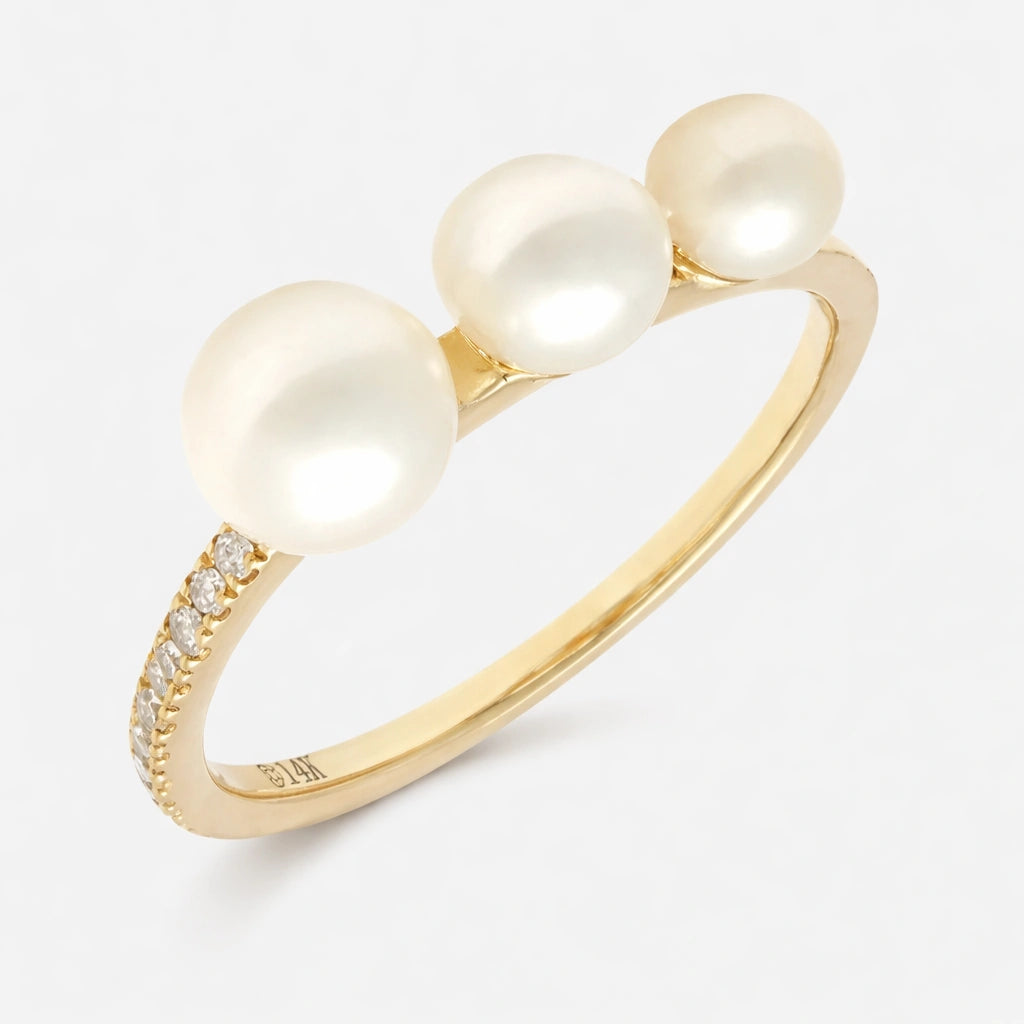 Triple pearl and diamond ring featuring three freshwater pearls and a diamond-accented band in 14K gold.