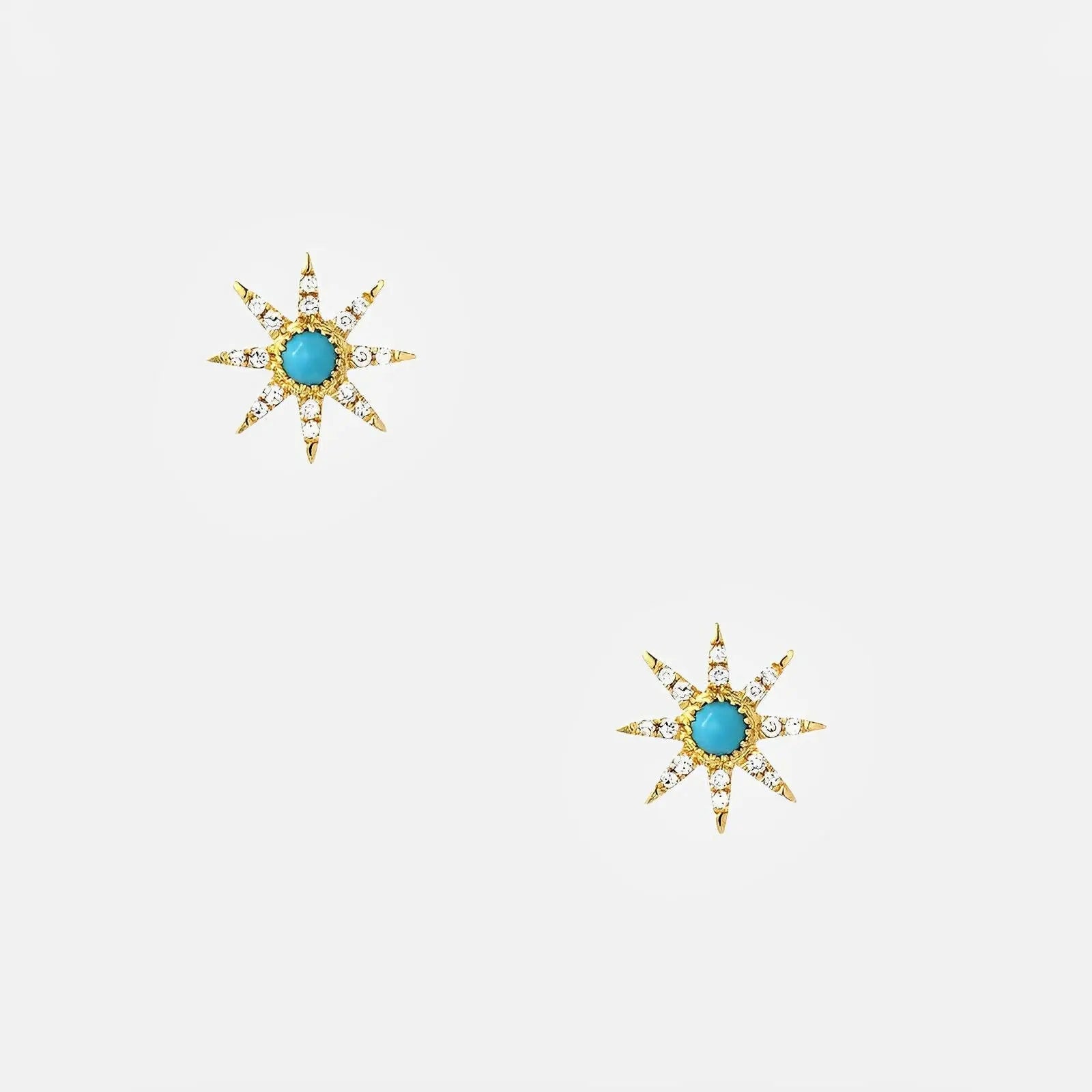 Gold three-quarter hoop earrings with turquoise bezel stones.